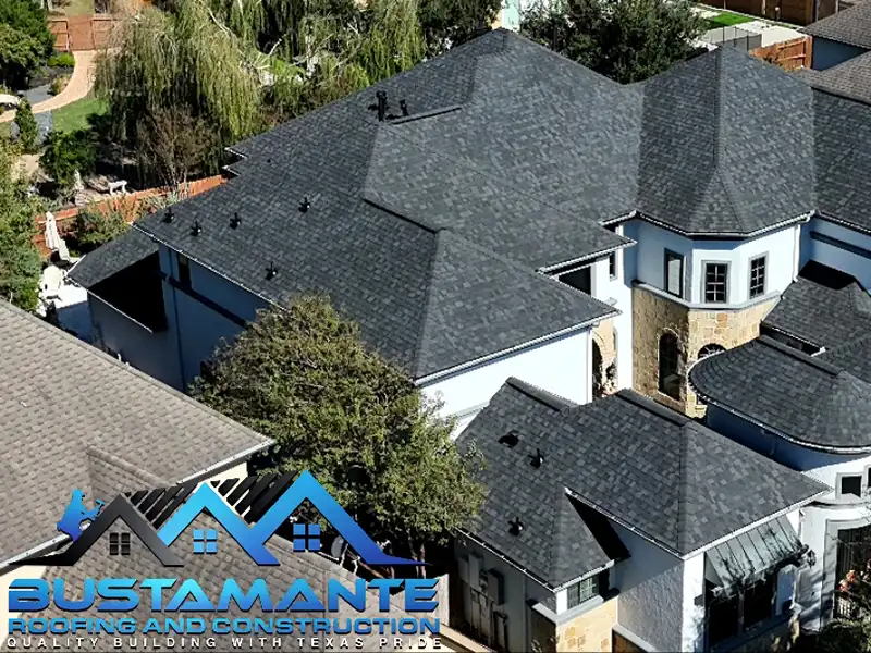 Large, high-end home with new dark gray roof shingles